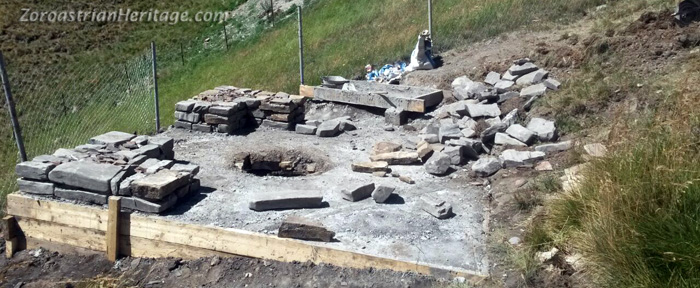 The first layer of stones for the building being laid. To ensure a strong base that wouldn't collapse during construction, the binding cement for the first row was allowed to cure for a day before the next layers were laid