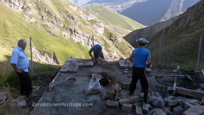 The first layer of stones for the building being laid. To ensure a strong base that wouldn't collapse during construction, the binding cement for the first row was allowed to cure for a day before the next layers were laid