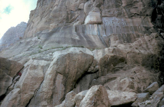 The approach to the inscriptions is over rocks