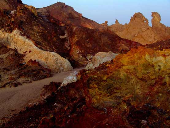 Layers of coloured soil in the hills of Hormuz Island