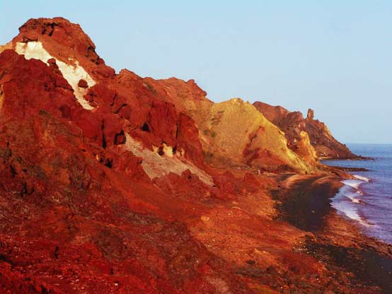 The red hills of Hormuz Island shore