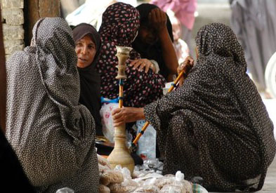 Women sharing a waterpipe at Minab's bazaar