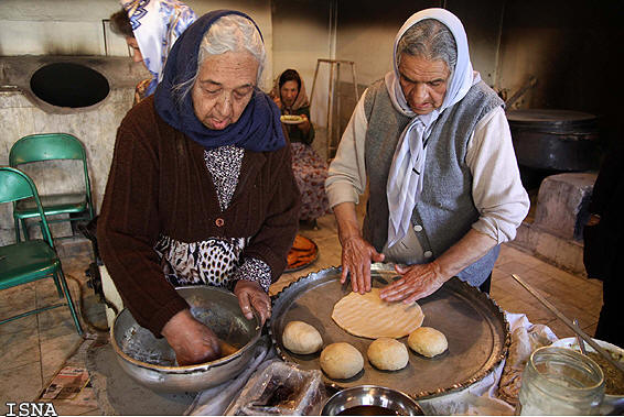 Kermani Zoroastrian ladies preparing for the feast of Jashne Sadeh