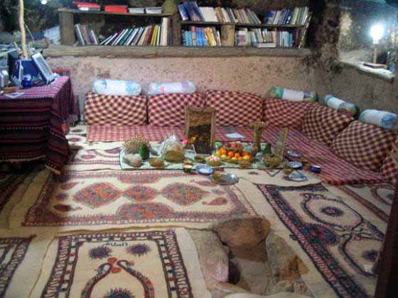 Modern cave dwelling interior. Note Nowruz sofreh (New Year's spread)