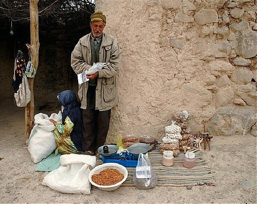 Street corner vendor selling handicrafts, dried nuts and dried cheese balls