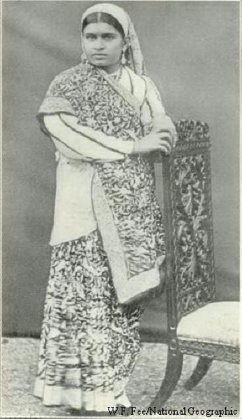 Woman against a chair. An albumen print 1880s.