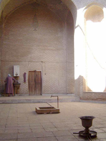 Fire temple in Mahale-ye Yazd. Note woman caretaker at far wall