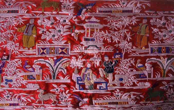 Embroidered Chinese design on a red ghat (Surat) silk gara specially ordered for a wedding.