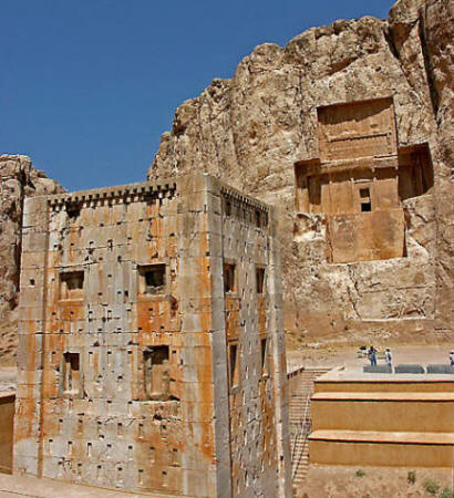 View of a tomb at Naqsh-e Rustam with the Kaba-e Zarthosht in the foreground. A Sassanian stone relief can be seen faintly just below the tomb
