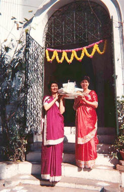 Navjote - Initiate's mother and aunt carry the sace
