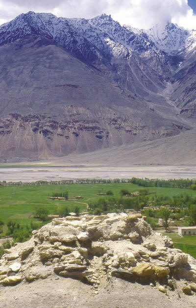 Looking south-east from the worship platform. The village of Vrang is immediately below. The river Panj flows at the foot of the Hindu Kush mountains